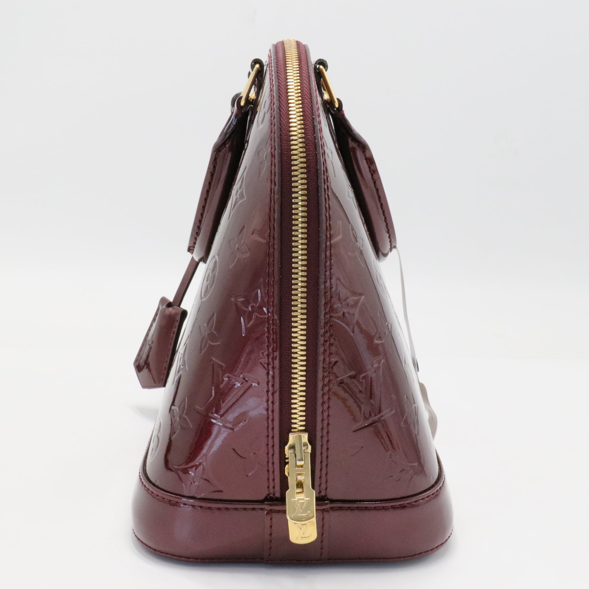 Alma Handbag Monogram Vernis PM