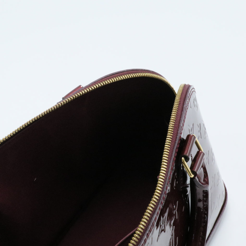 Alma Handbag Monogram Vernis PM