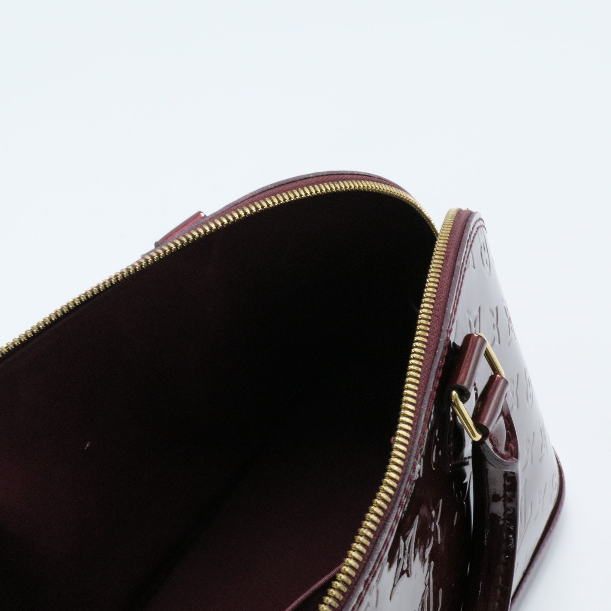 Alma Handbag Monogram Vernis PM