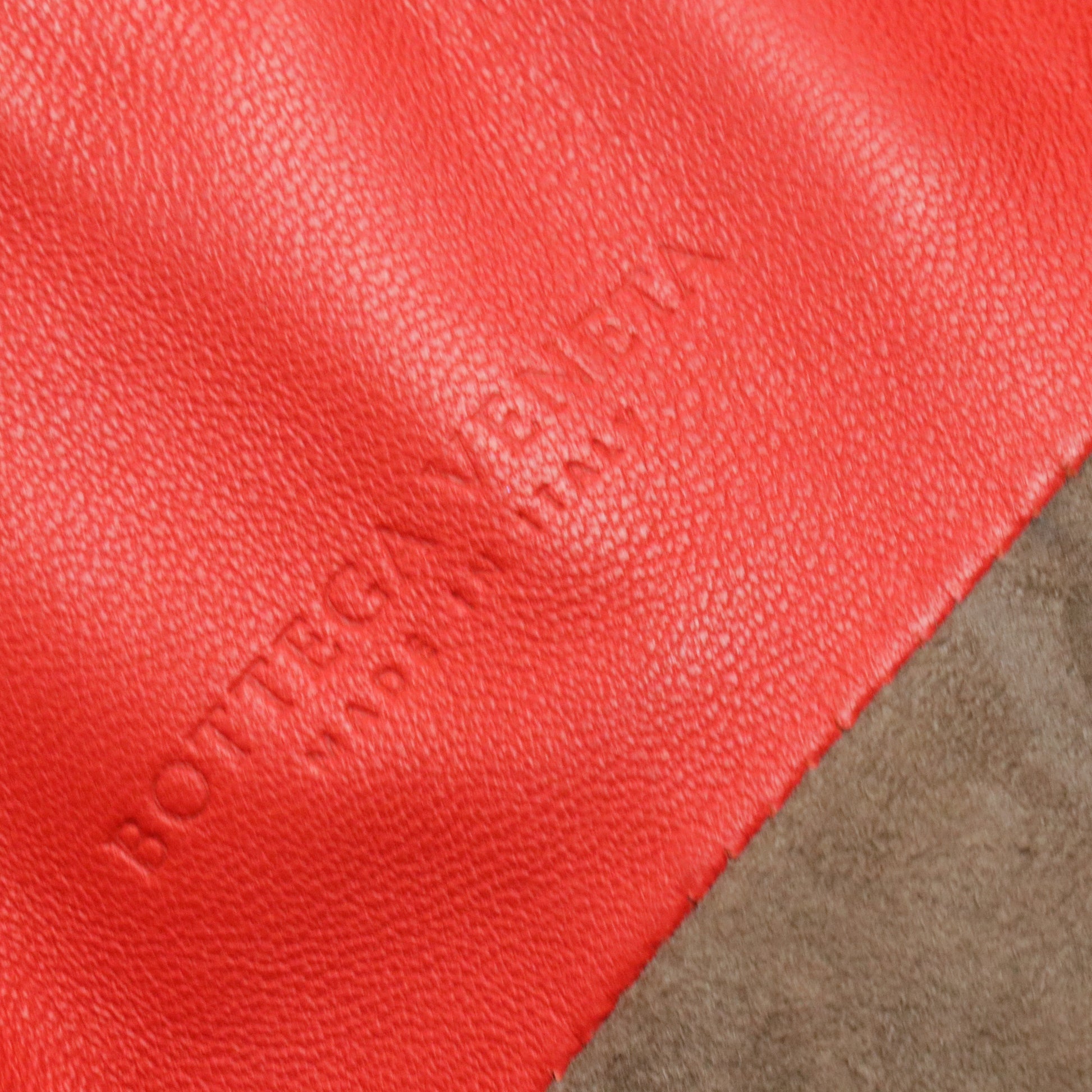 Red Intrecciato Leather Drawstring Bucket Bag