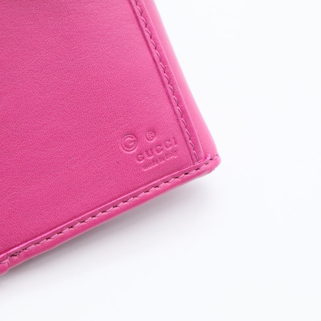 Gucci Interlocking Studded Continental Flap Wallet in a pink