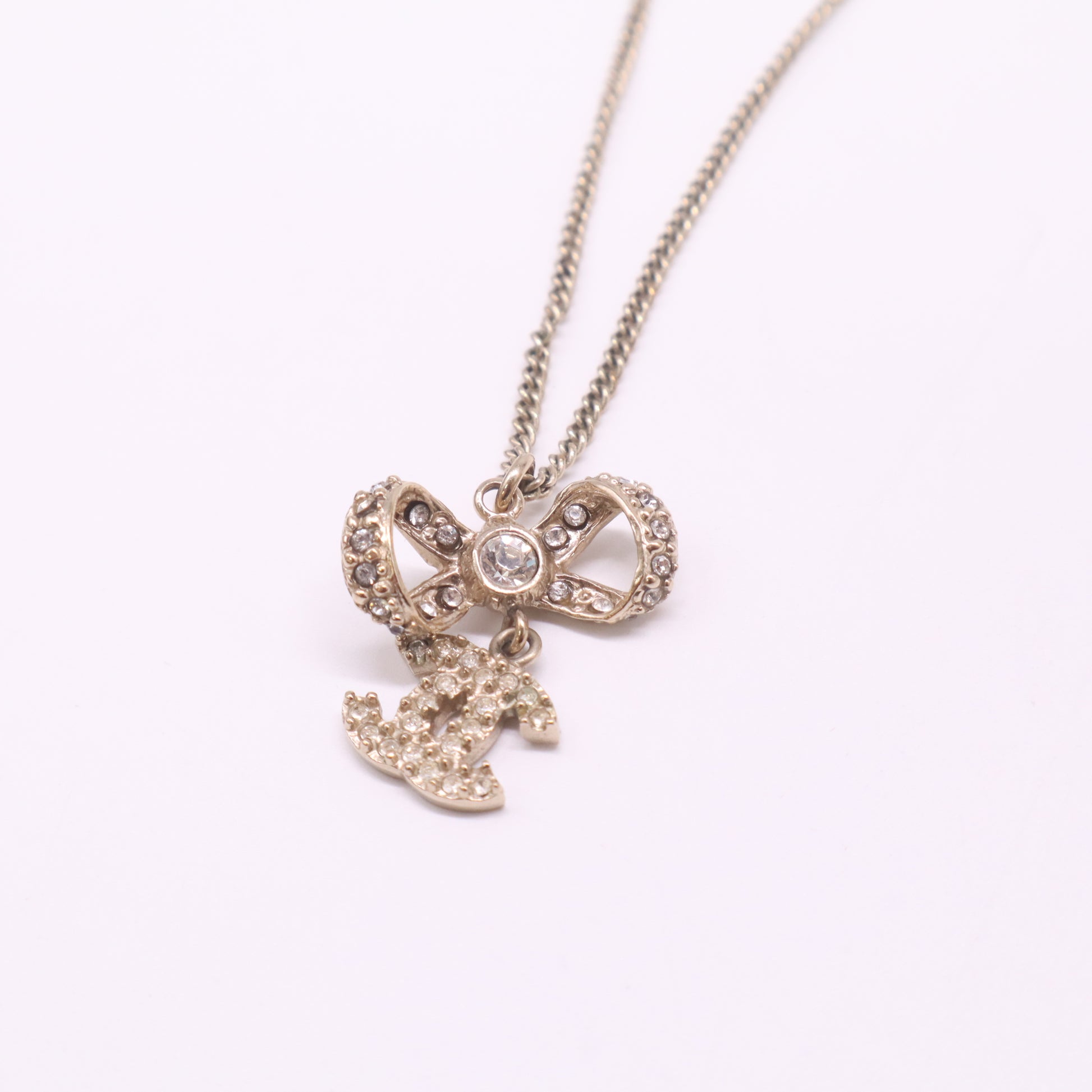 Chanel CC Rhinestone Bow Pendant Necklace W22453