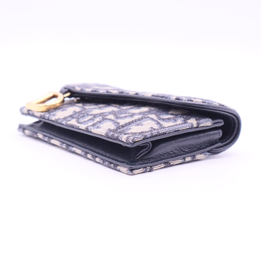 Oblique Monogram Saddle Flip Card Holder