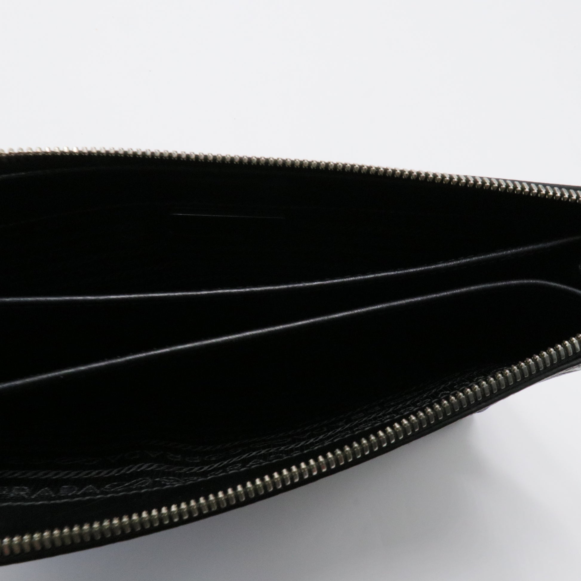 Saffiano enamel triangle logo zipped clutch