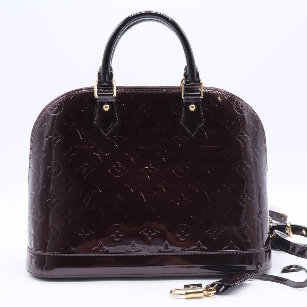 Alma Handbag Monogram Vernis PM