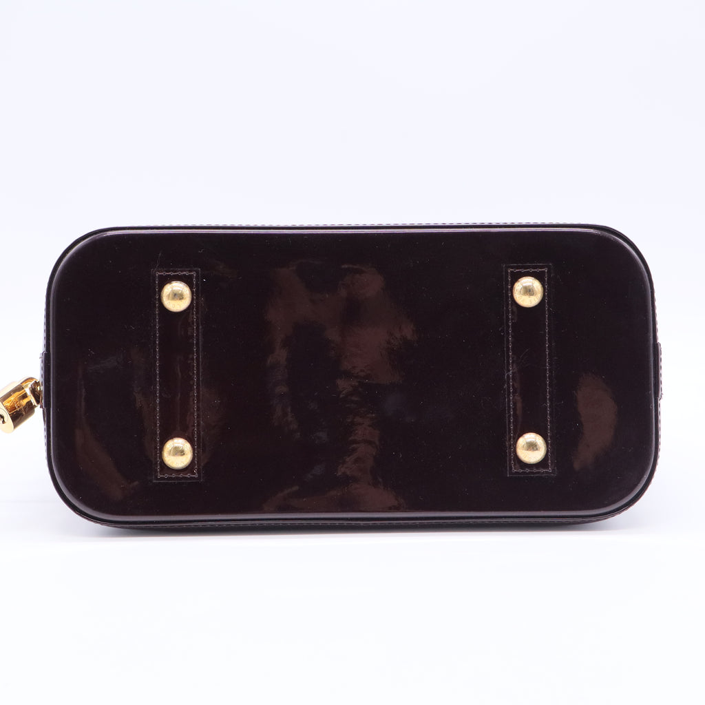 Alma Handbag Monogram Vernis PM