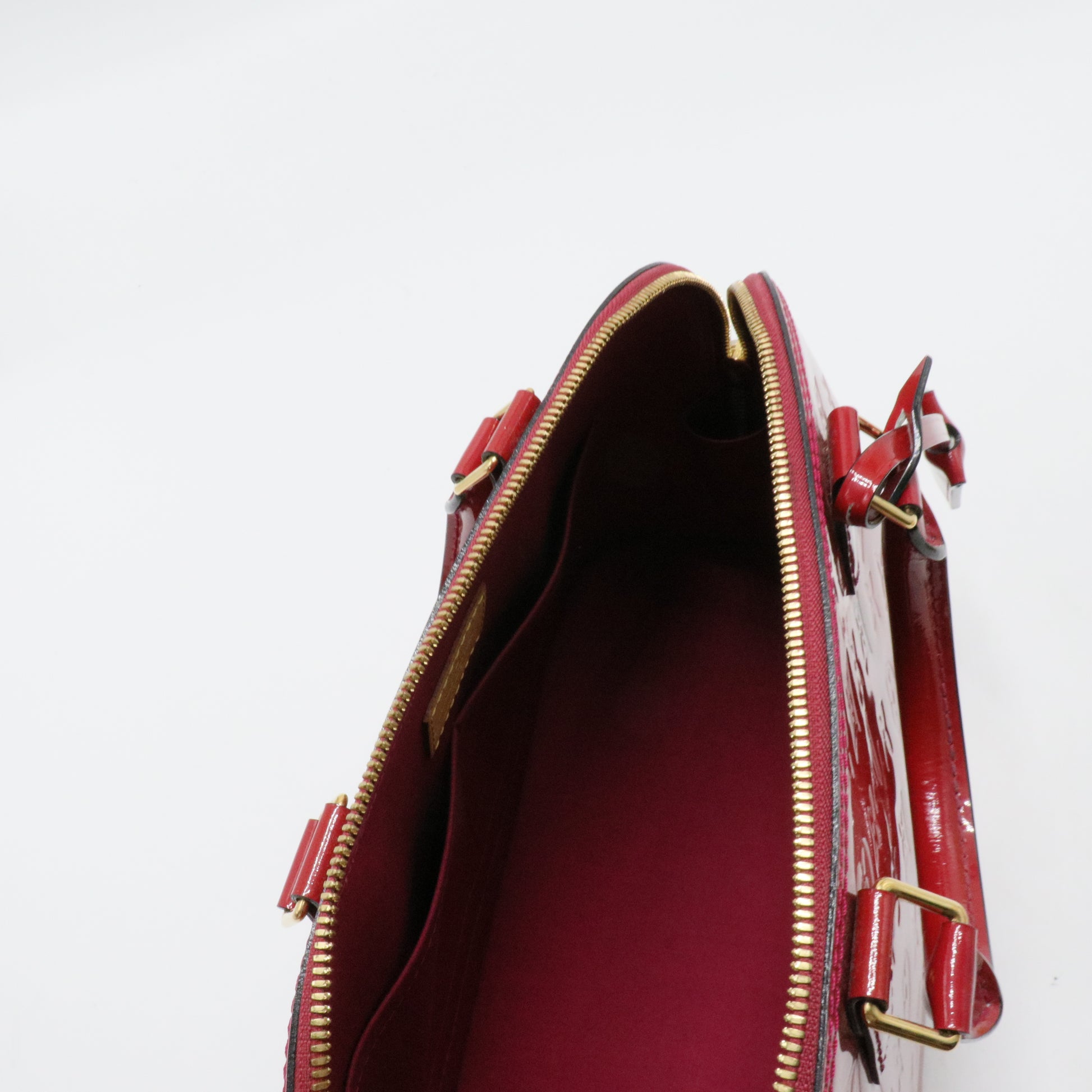 Alma Handbag Monogram Vernis PM