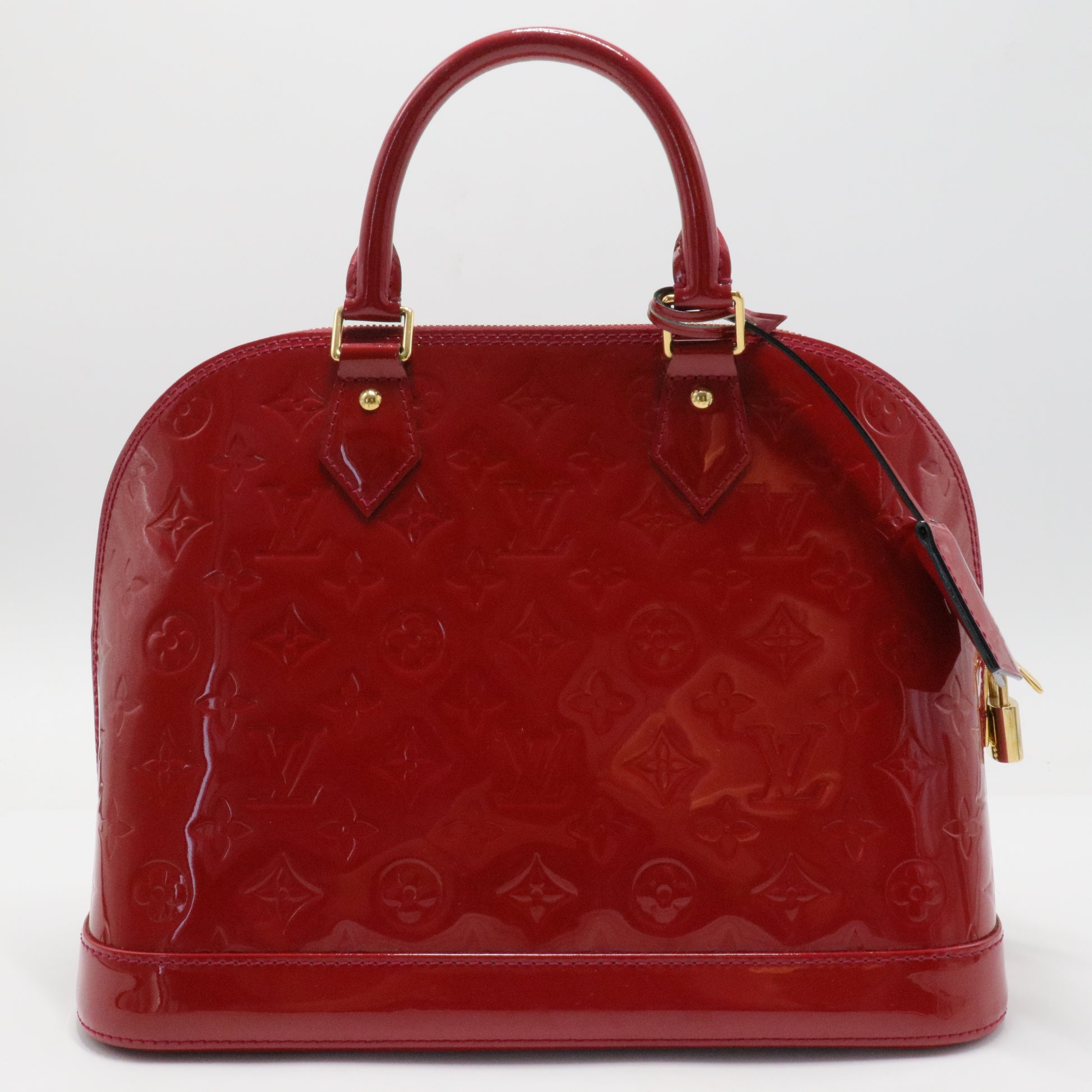 Alma Handbag Monogram Vernis PM