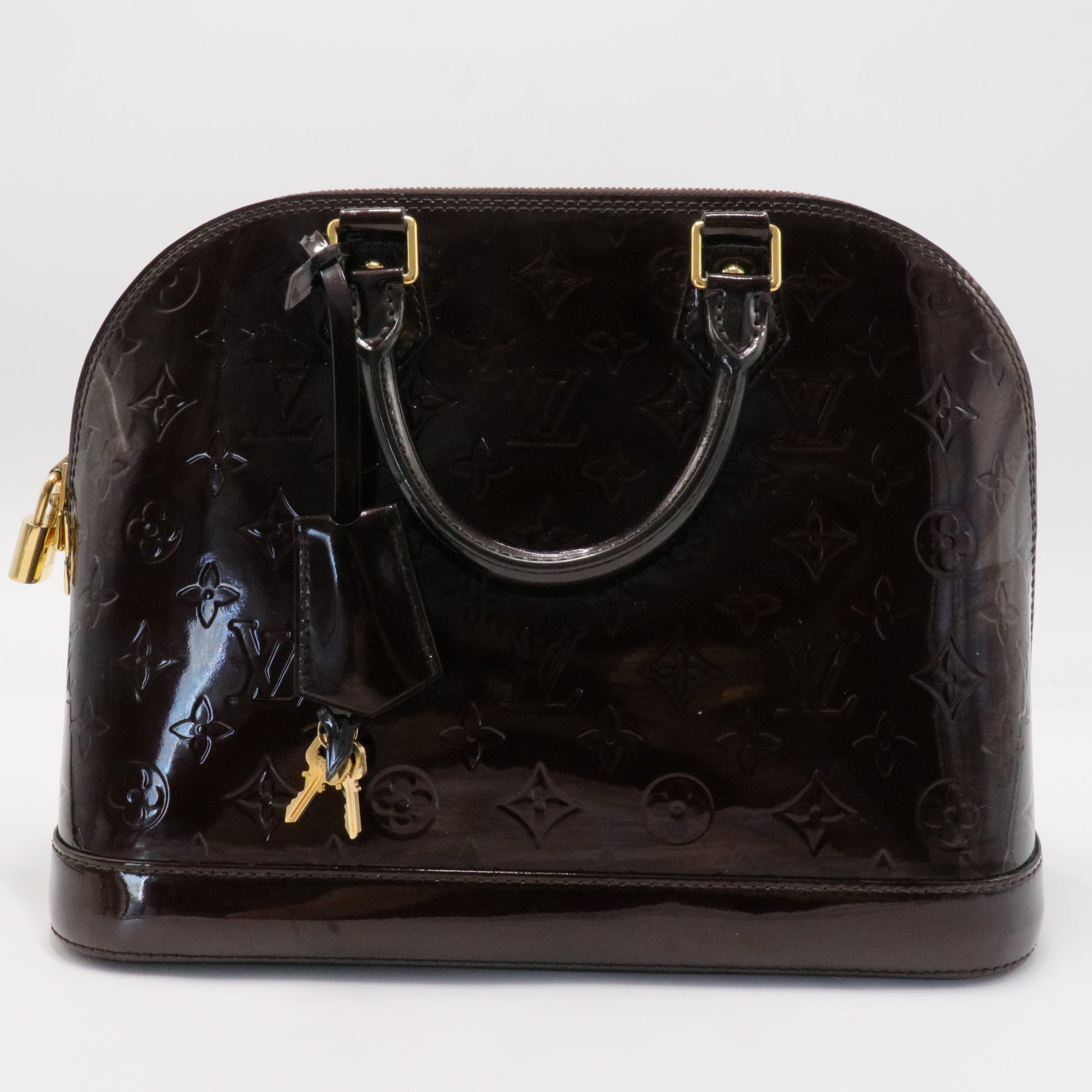 Alma Handbag Monogram Vernis PM