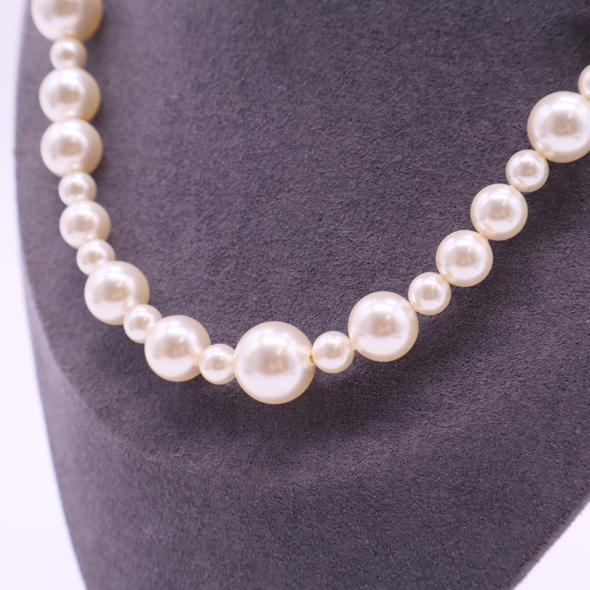 Pearl Necklace with Gold Emblem