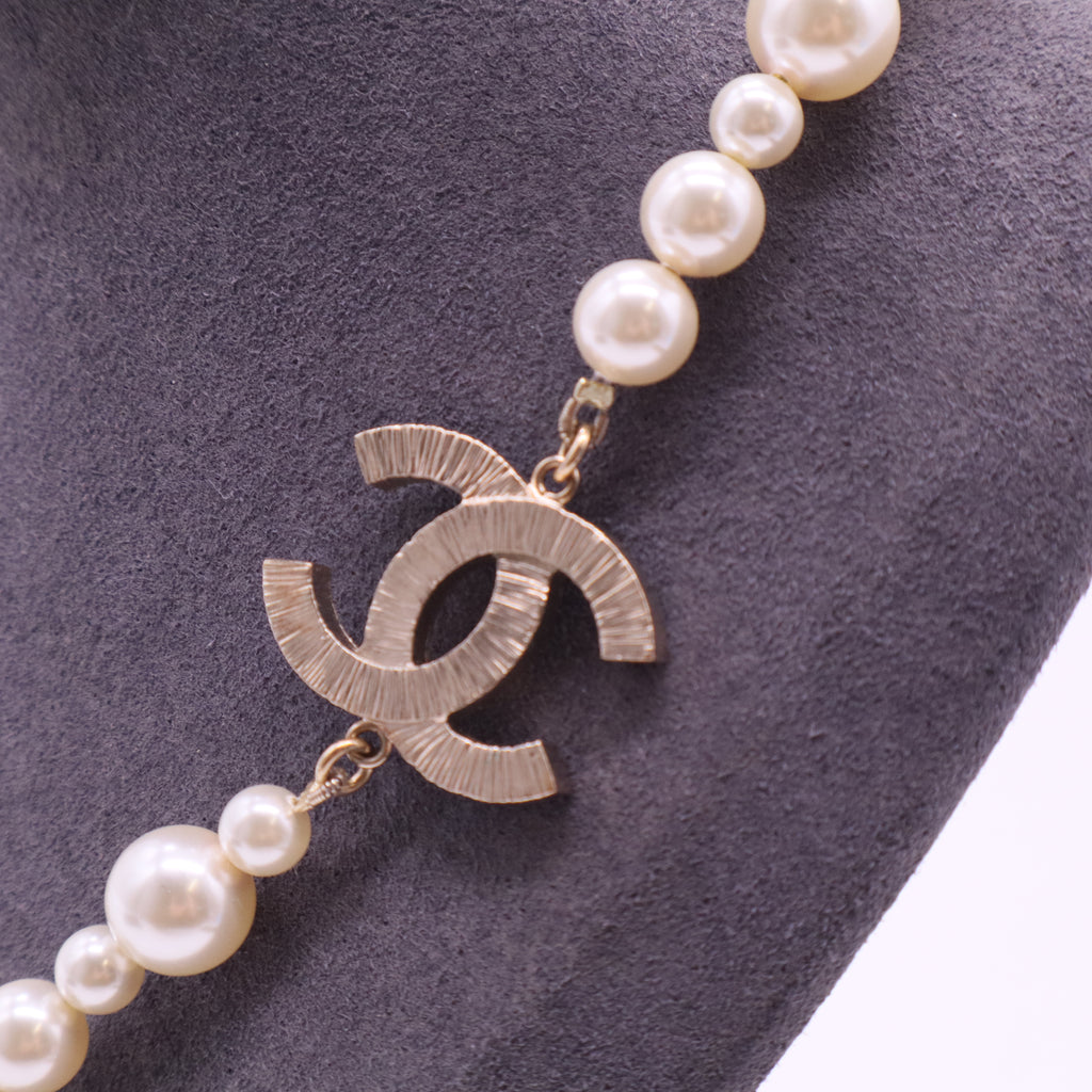 Pearl Necklace with Gold Emblem