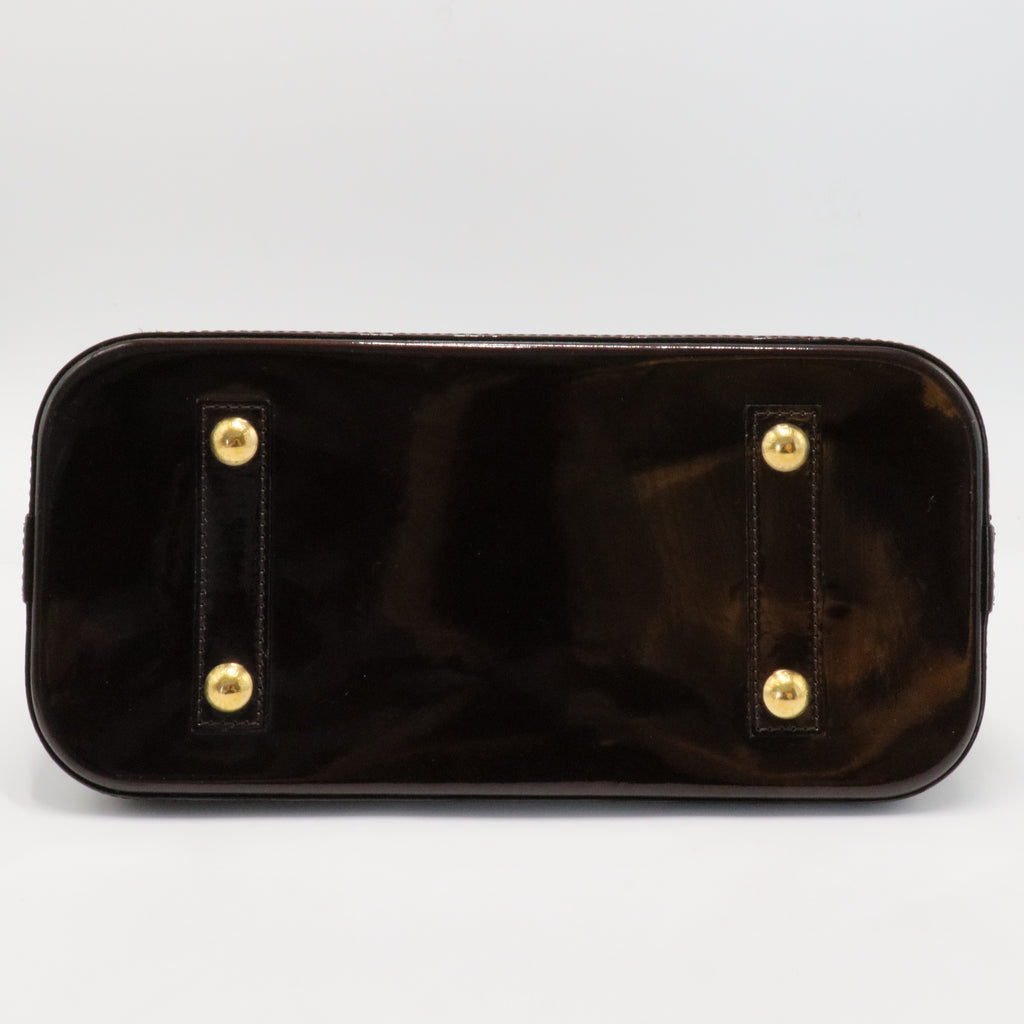 Alma Handbag Monogram Vernis PM