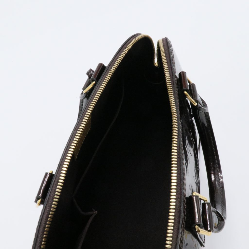 Alma Handbag Monogram Vernis PM