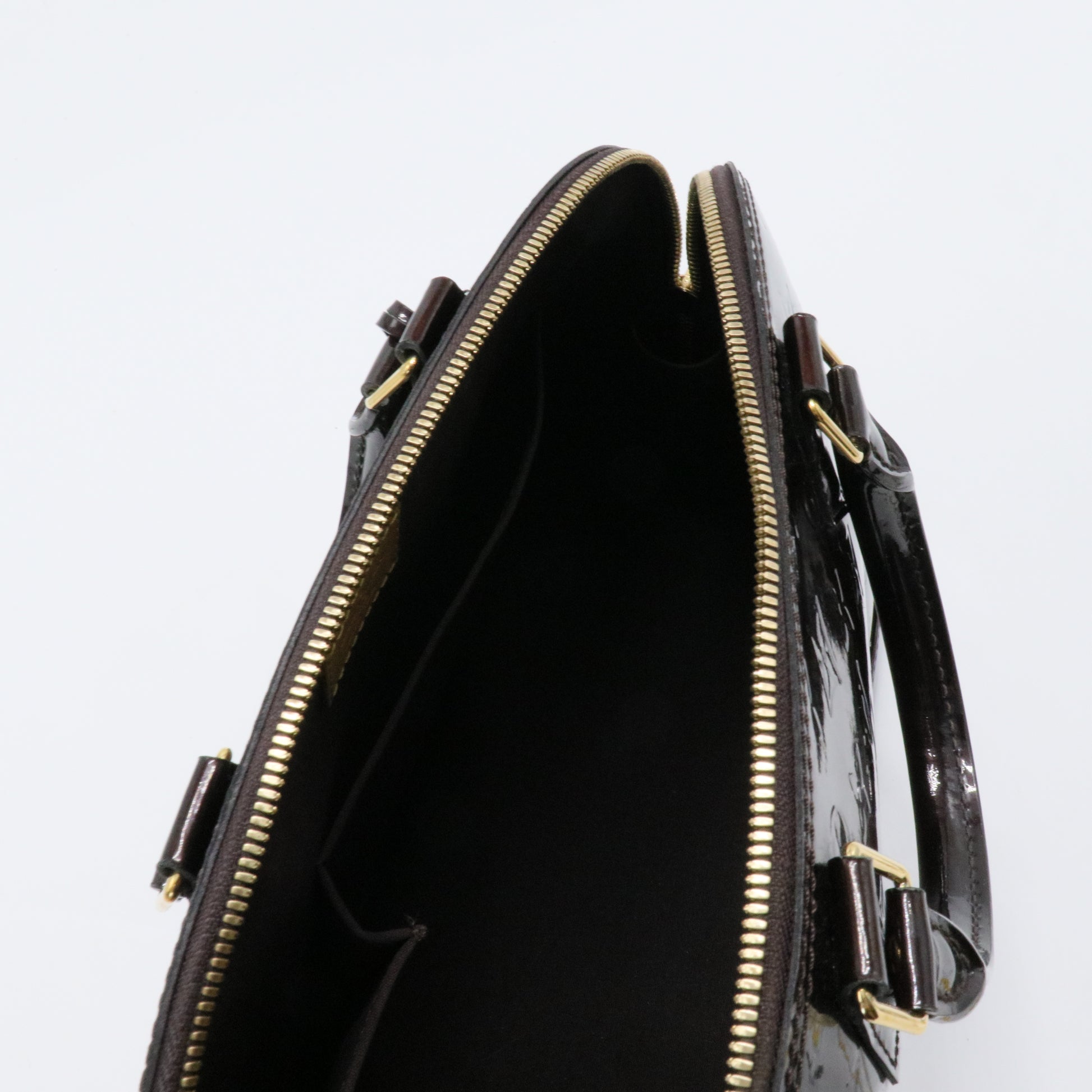Alma Handbag Monogram Vernis PM