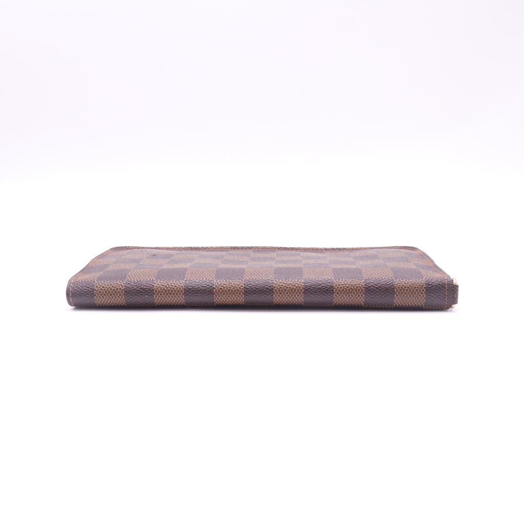 Louis Vuitton Zippy Wallet in Damier Ébène Canvas W22535