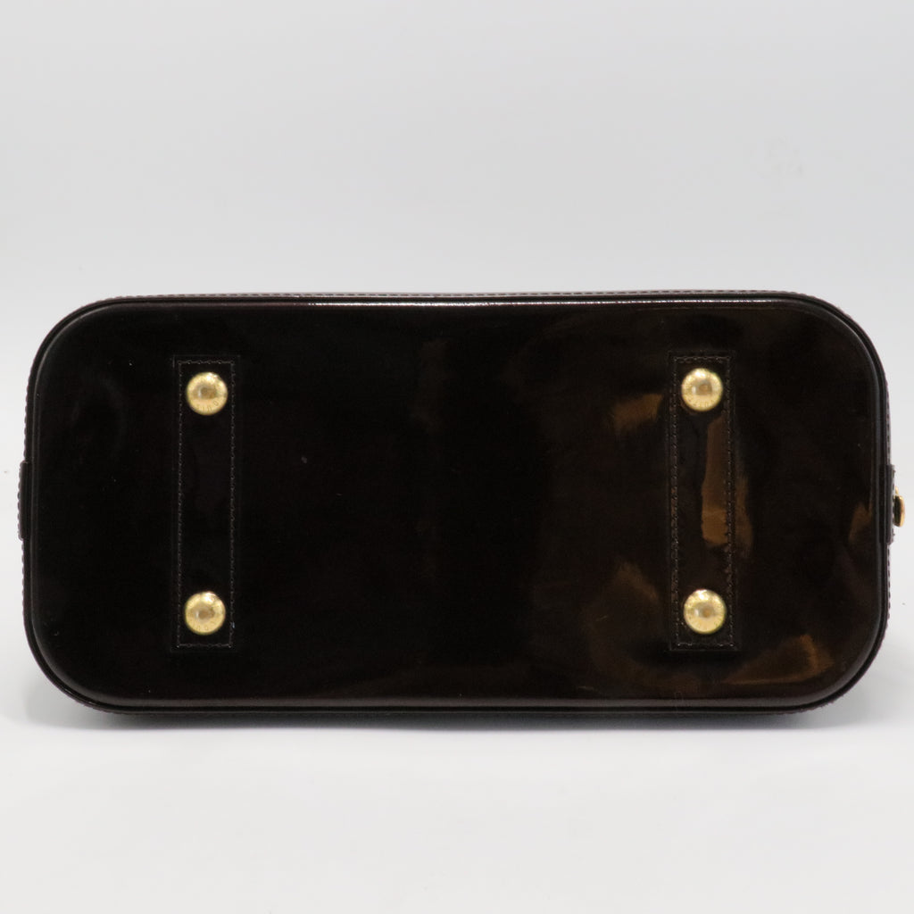 Alma Handbag Monogram Vernis PM