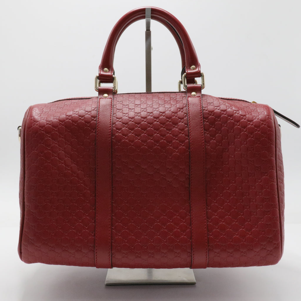 Joy Boston Bag Microguccissima Leather Medium