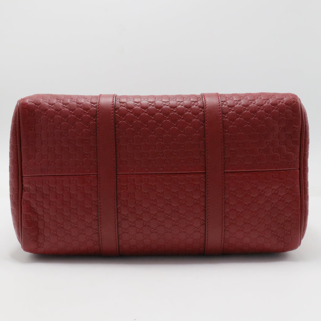 Joy Boston Bag Microguccissima Leather Medium