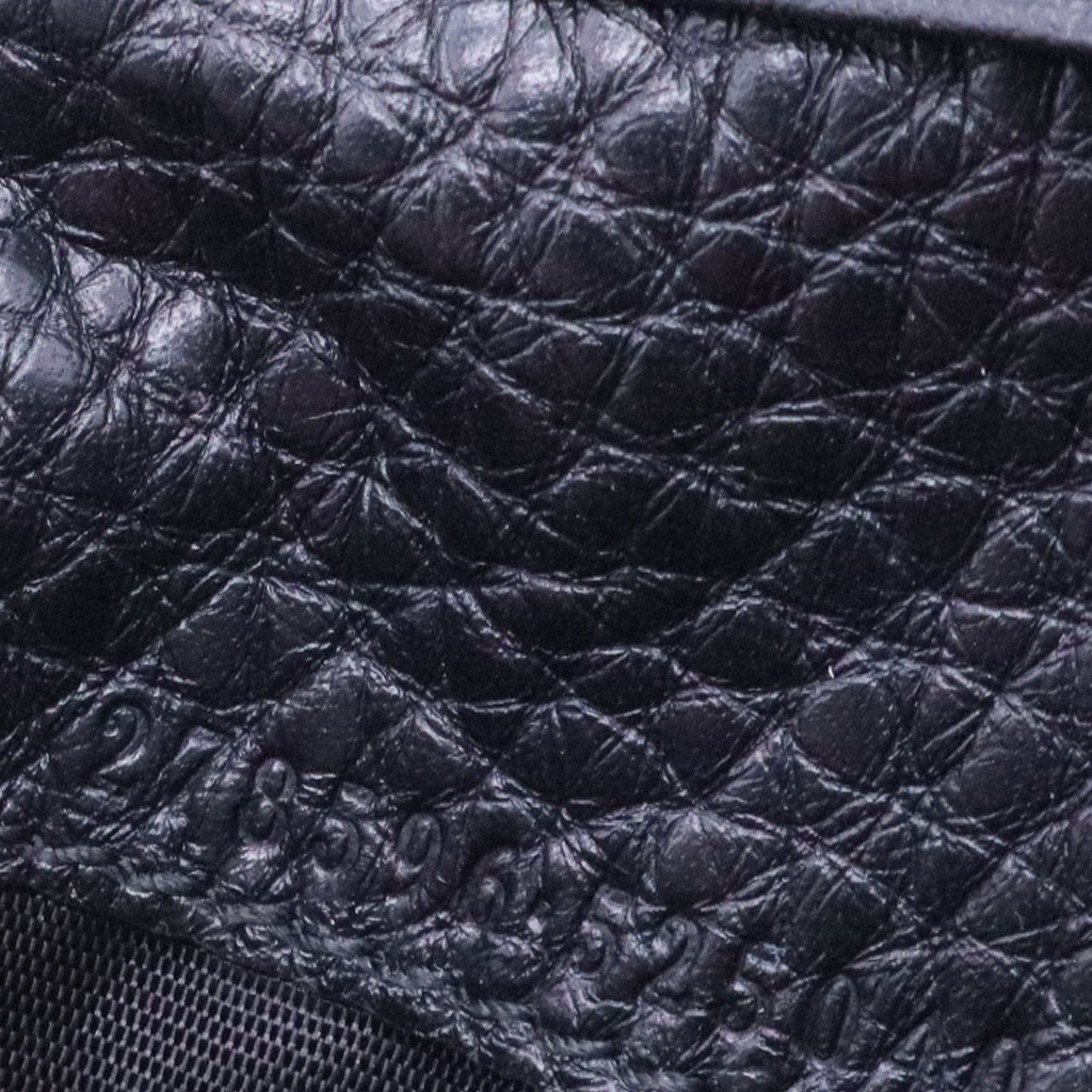 Bi-fold wallet with Gucci logo in black leather