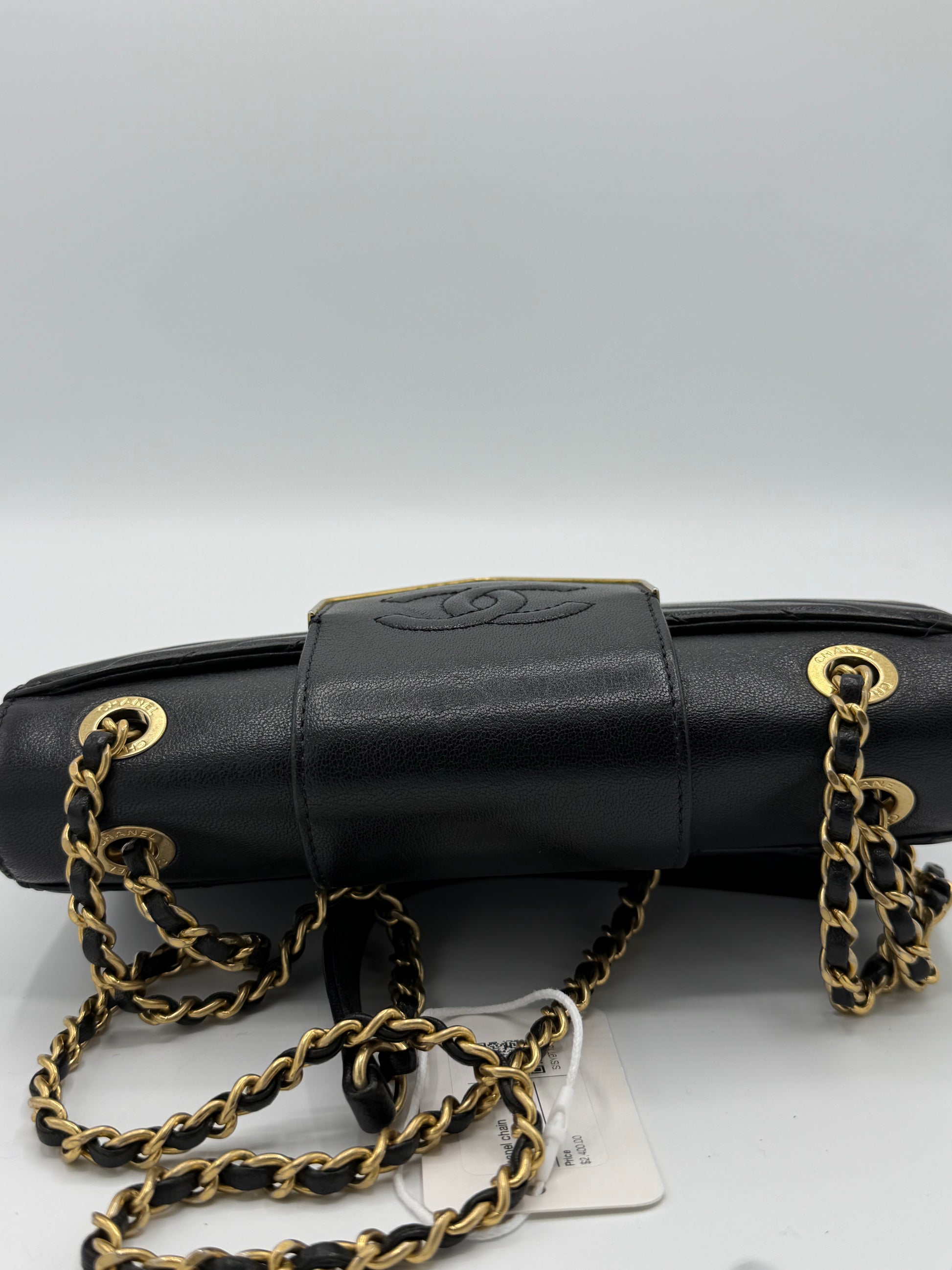 Collar and Tie Flap Bag in black sheepskin leather