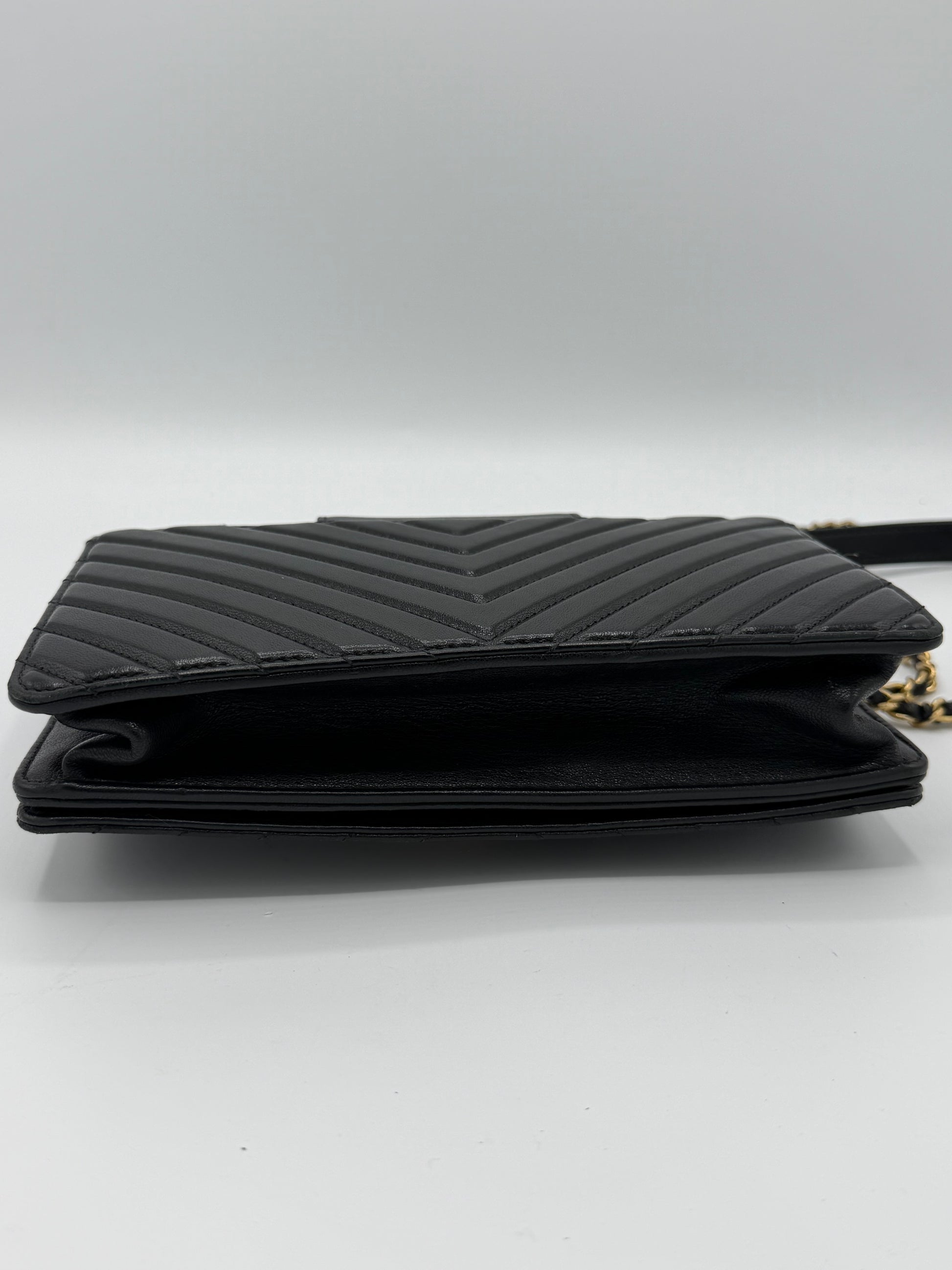 Collar and Tie Flap Bag in black sheepskin leather