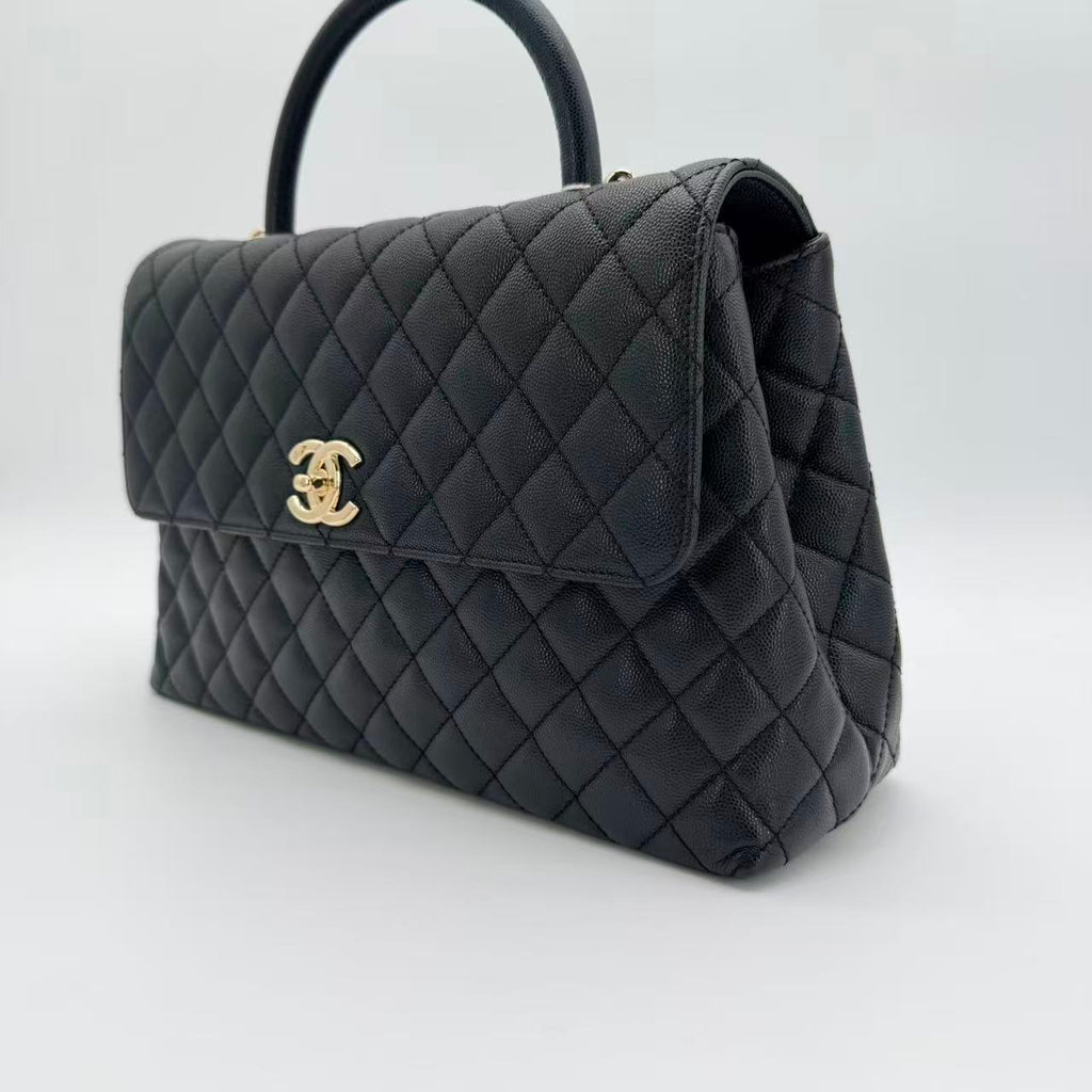 Coco Handle Flap Bag in black caviar leather with gold-tone HW