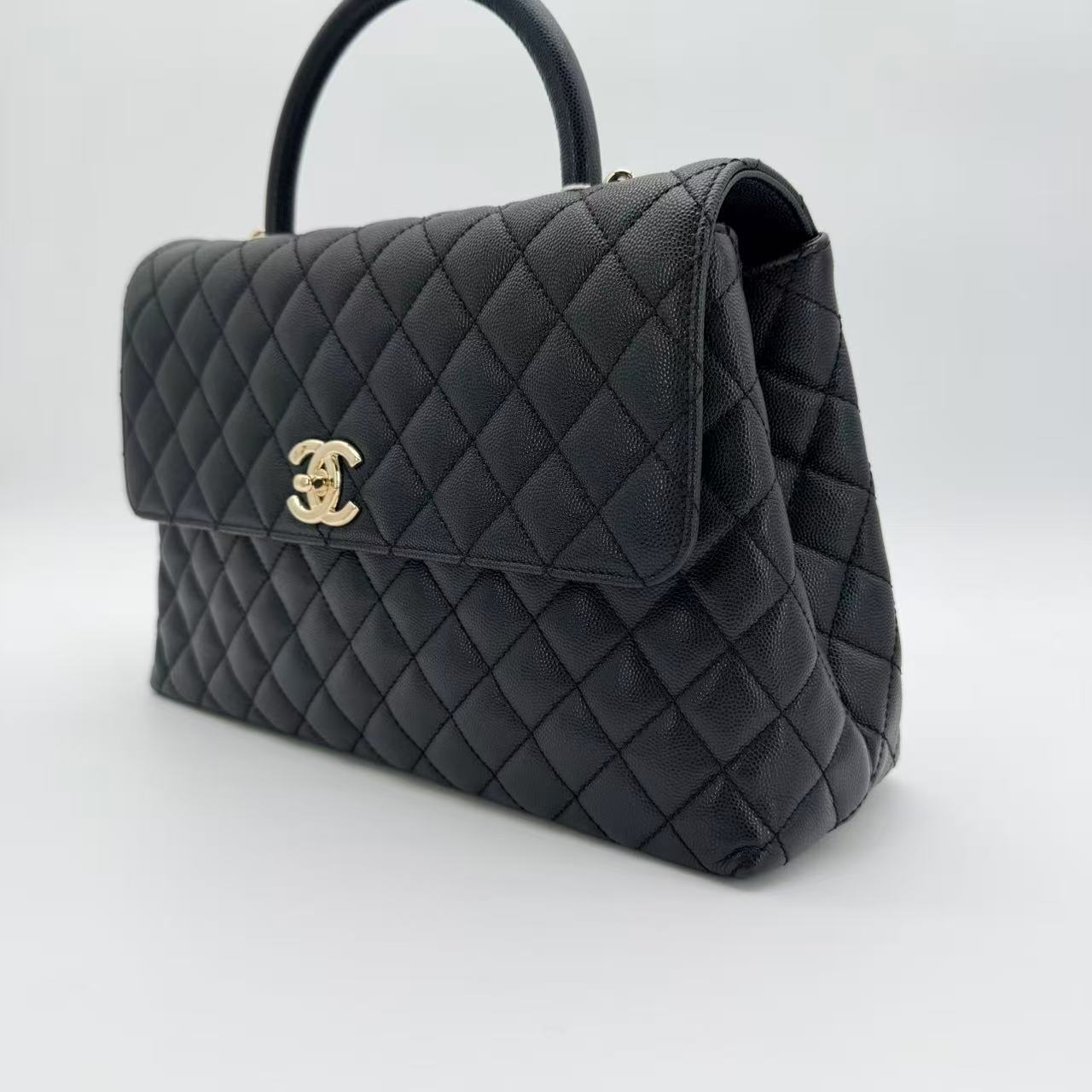 Coco Handle Flap Bag in black caviar leather with gold-tone HW