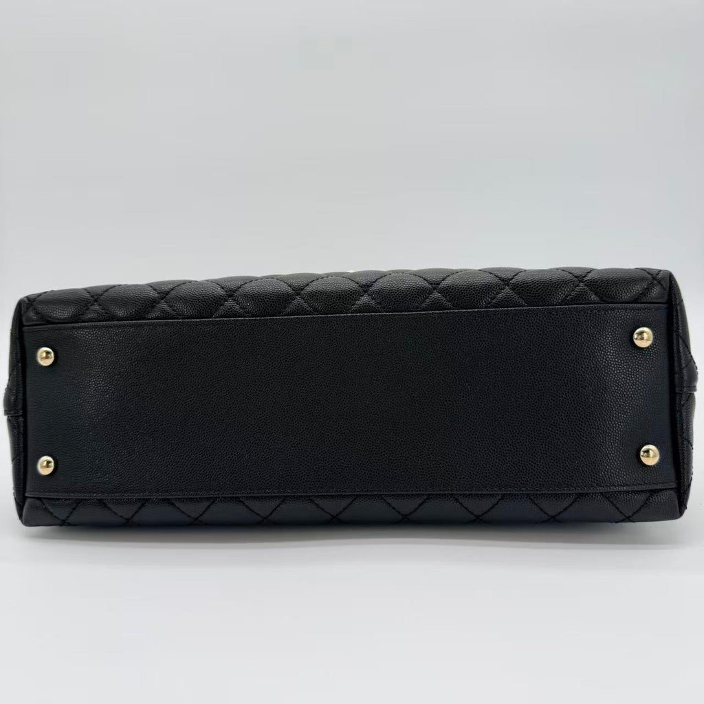 Coco Handle Flap Bag in black caviar leather with gold-tone HW
