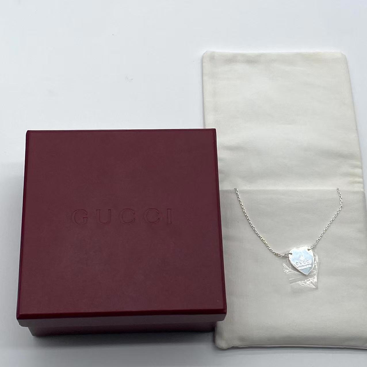 Trademark necklace with heart pendant