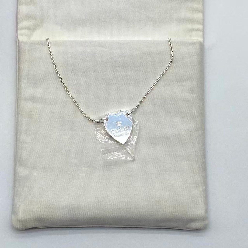 Trademark necklace with heart pendant