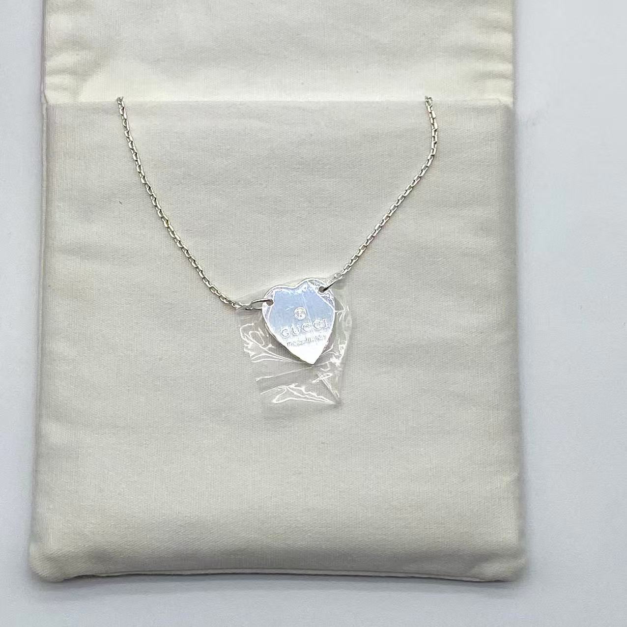 Trademark necklace with heart pendant